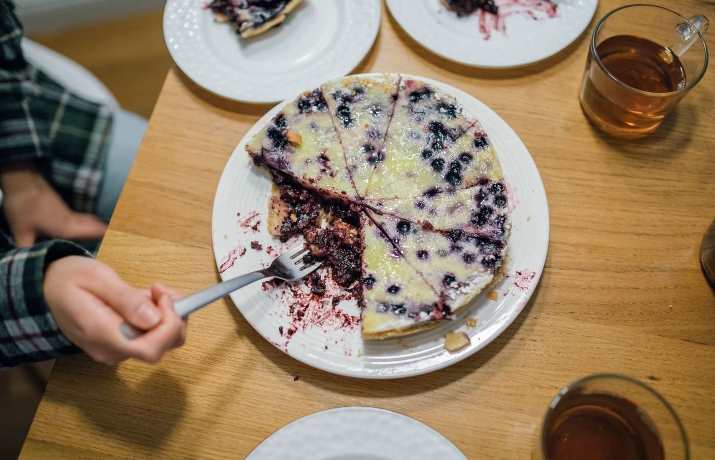 Slice of fruit pie with visible fruit pieces